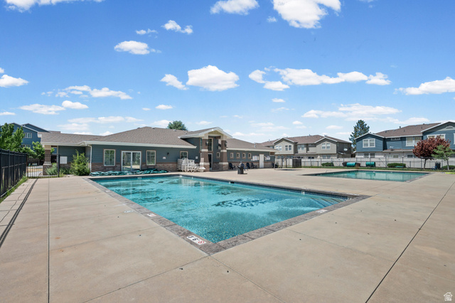 8248 South Resaca Drive, Unit J10 Sandy, UT 84070 - Photo 26 of 40 Community swimming pool with concrete decking