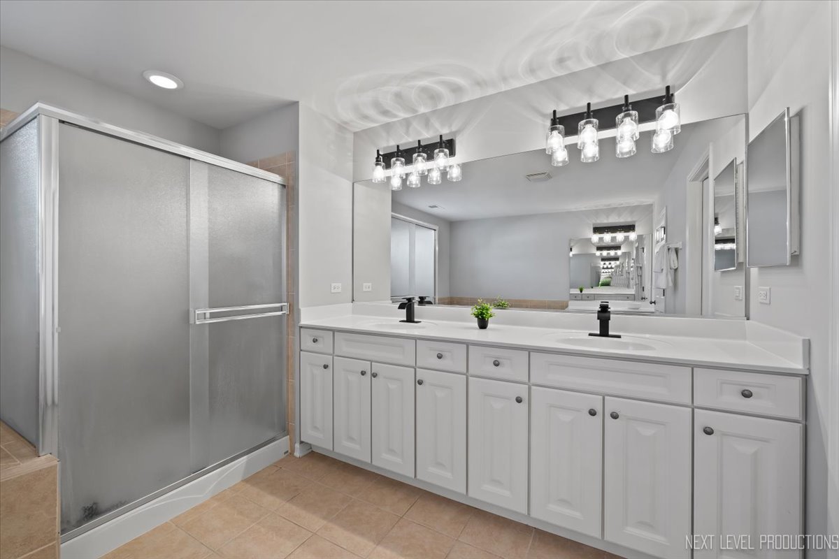 3520 Timber Creek Lane Naperville, IL 60565 - Photo 27 of 50 a bathroom with a double vanity sink and a mirror