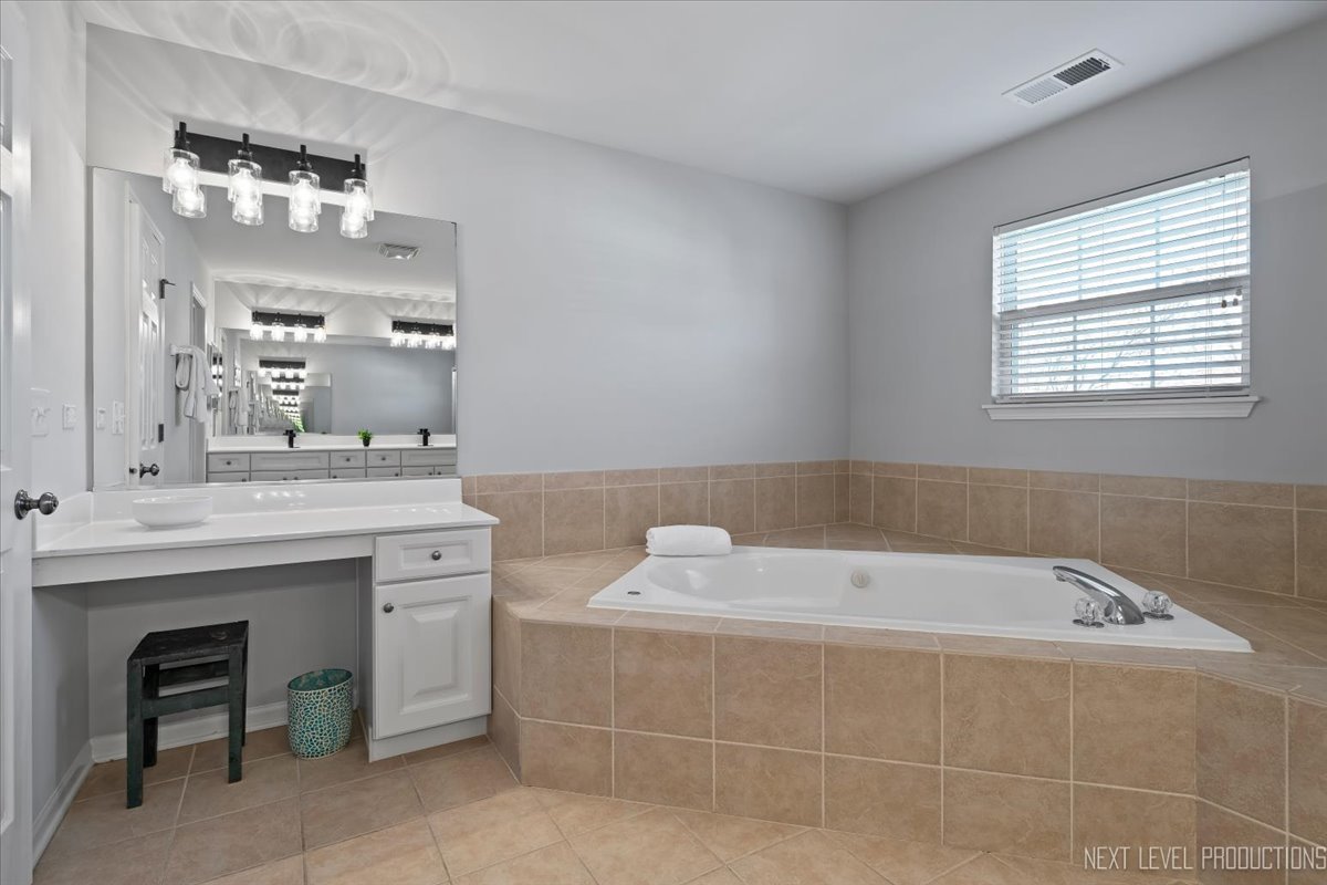 3520 Timber Creek Lane Naperville, IL 60565 - Photo 28 of 50 a bathroom with a bathtub and a sink