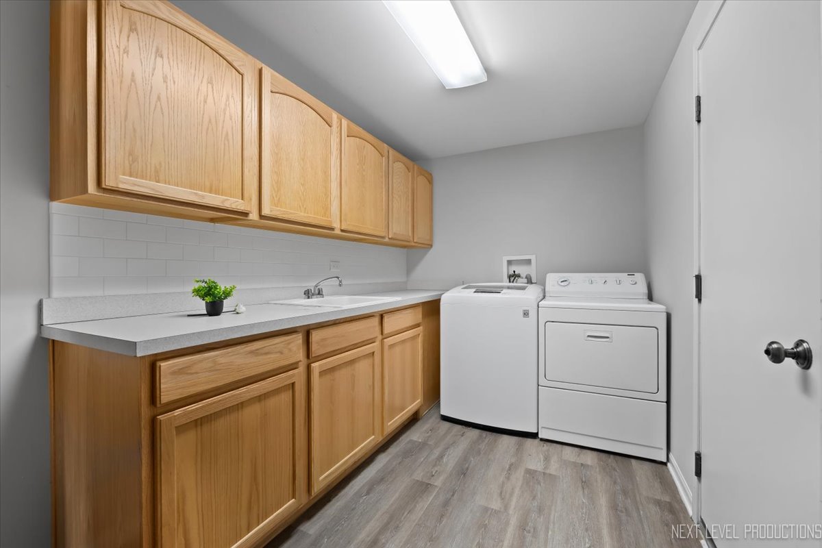 3520 Timber Creek Lane Naperville, IL 60565 - Photo 31 of 50 a utility room with cabinets washer and dryer