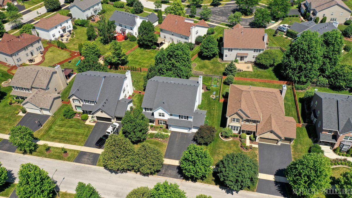 3520 Timber Creek Lane Naperville, IL 60565 - Photo 35 of 50 an aerial view of a house with yard and outdoor seating
