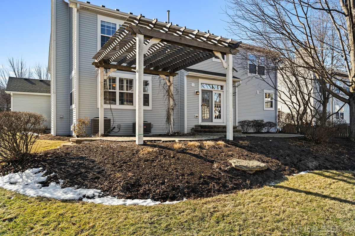 3520 Timber Creek Lane Naperville, IL 60565 - Photo 42 of 50 a view of a house with a snow