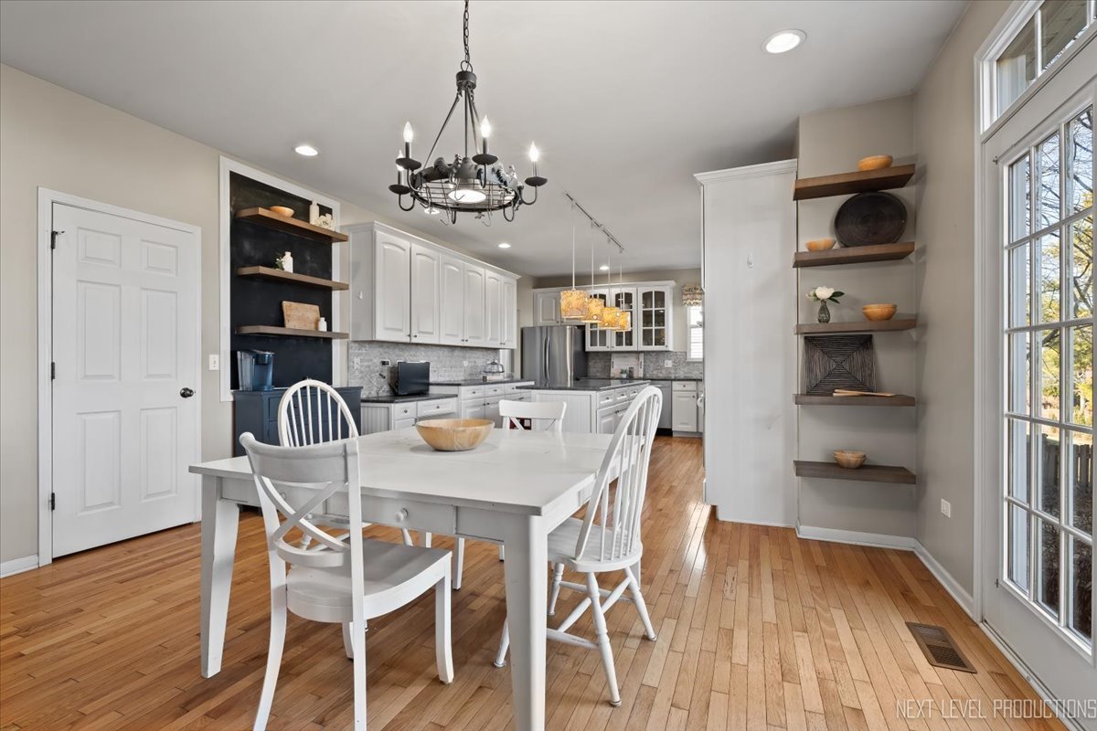 3520 Timber Creek Lane Naperville, IL 60565 - Photo 5 of 50 a view of a dining room with furniture and wooden floor