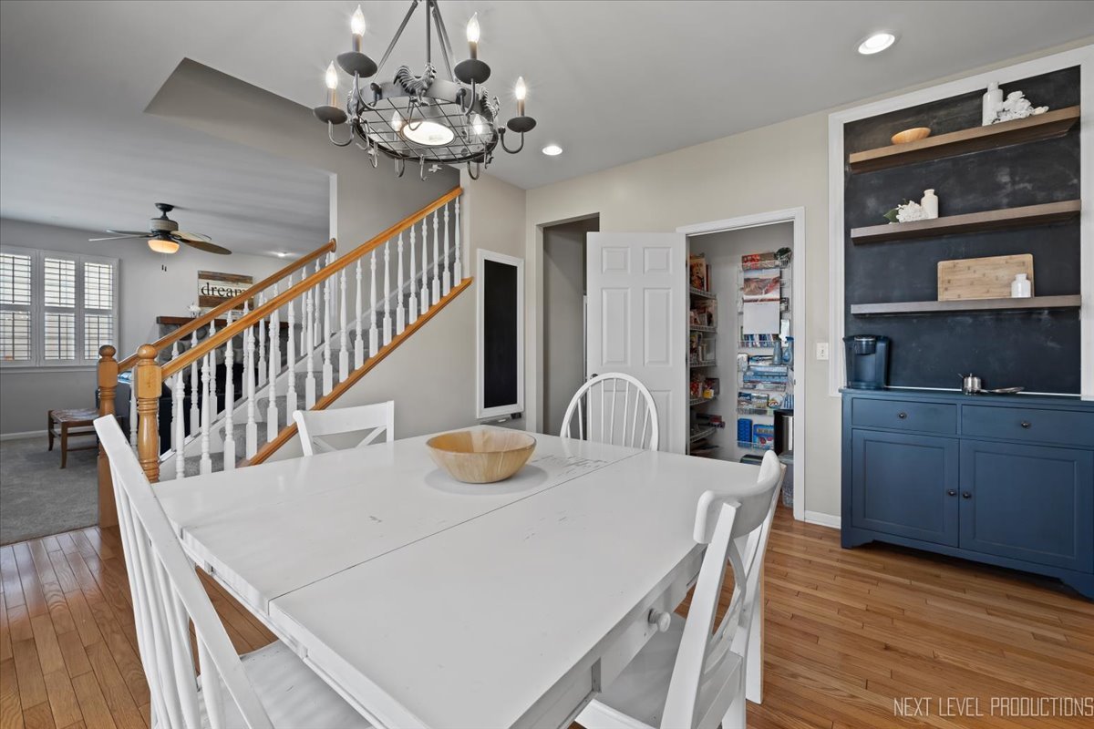 3520 Timber Creek Lane Naperville, IL 60565 - Photo 7 of 50 a view of a dining room with furniture and wooden floor