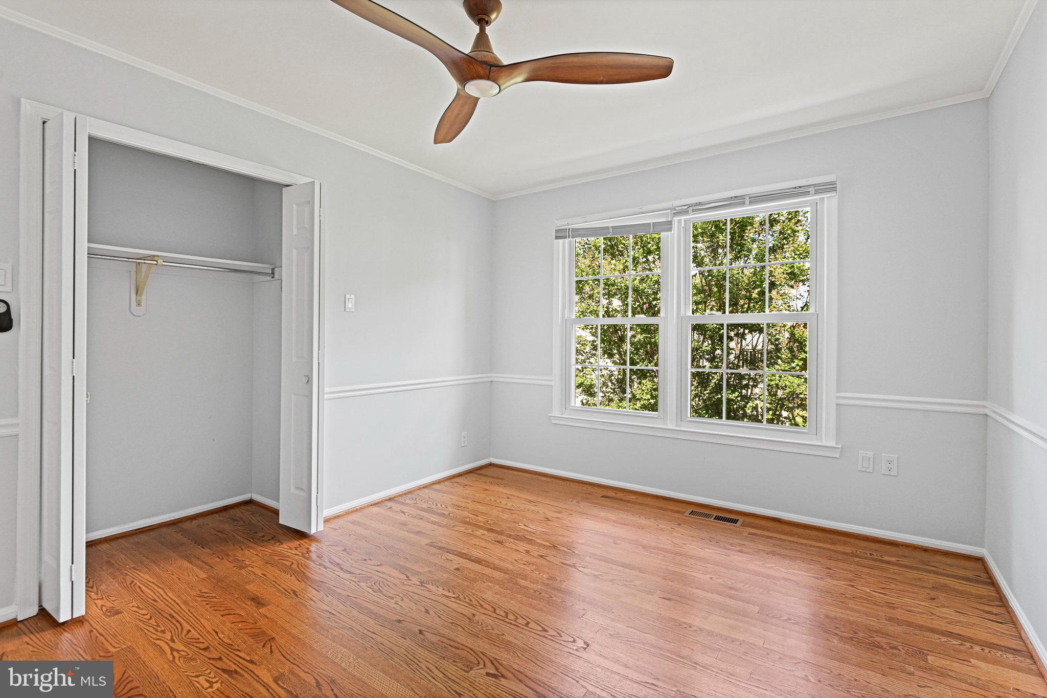 13345 Point Rider Lane Herndon, VA 20171 - Photo 30 of 43 a view of an empty room with wooden floor and a window