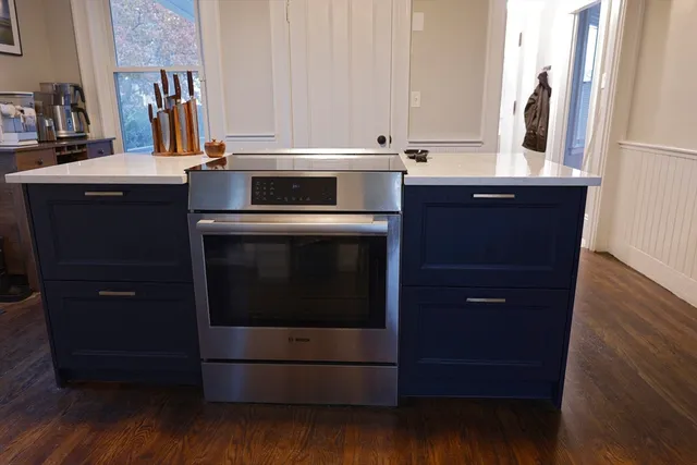 a kitchen with a sink and a refrigerator