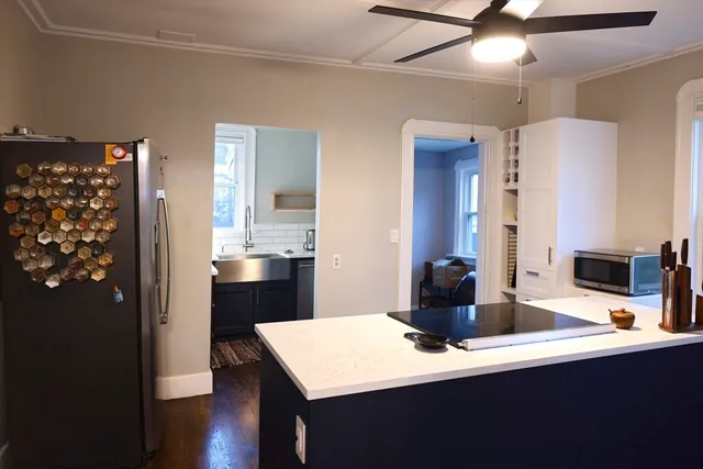 a kitchen with a sink and refrigerator