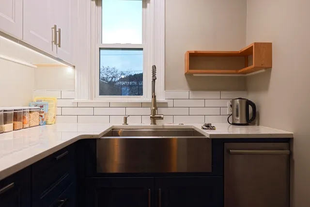 a kitchen with a sink and a window