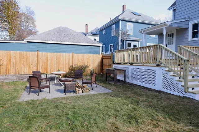 a view of a house with backyard porch and sitting area