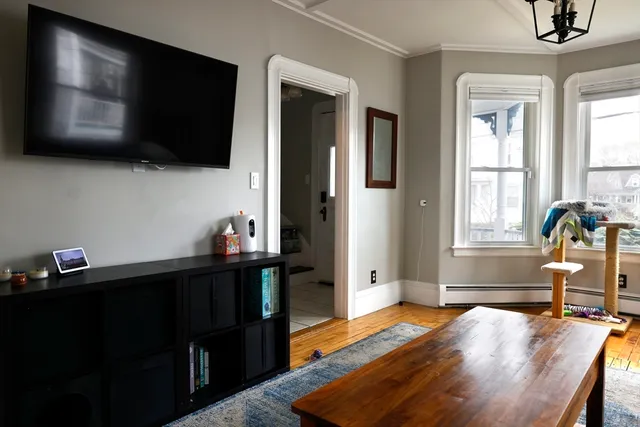 a bedroom with furniture and flat screen tv