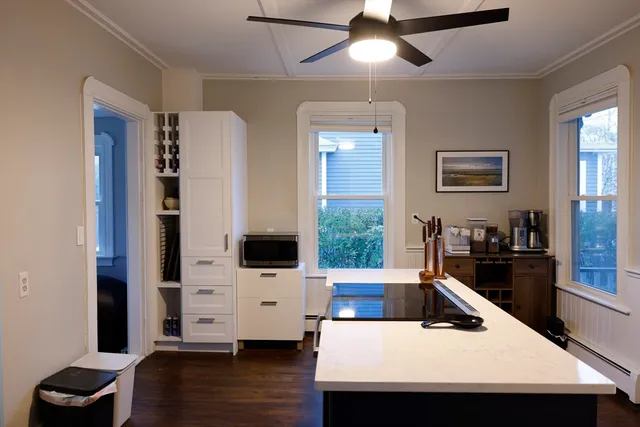 a kitchen with stainless steel appliances kitchen island granite countertop a sink and cabinets