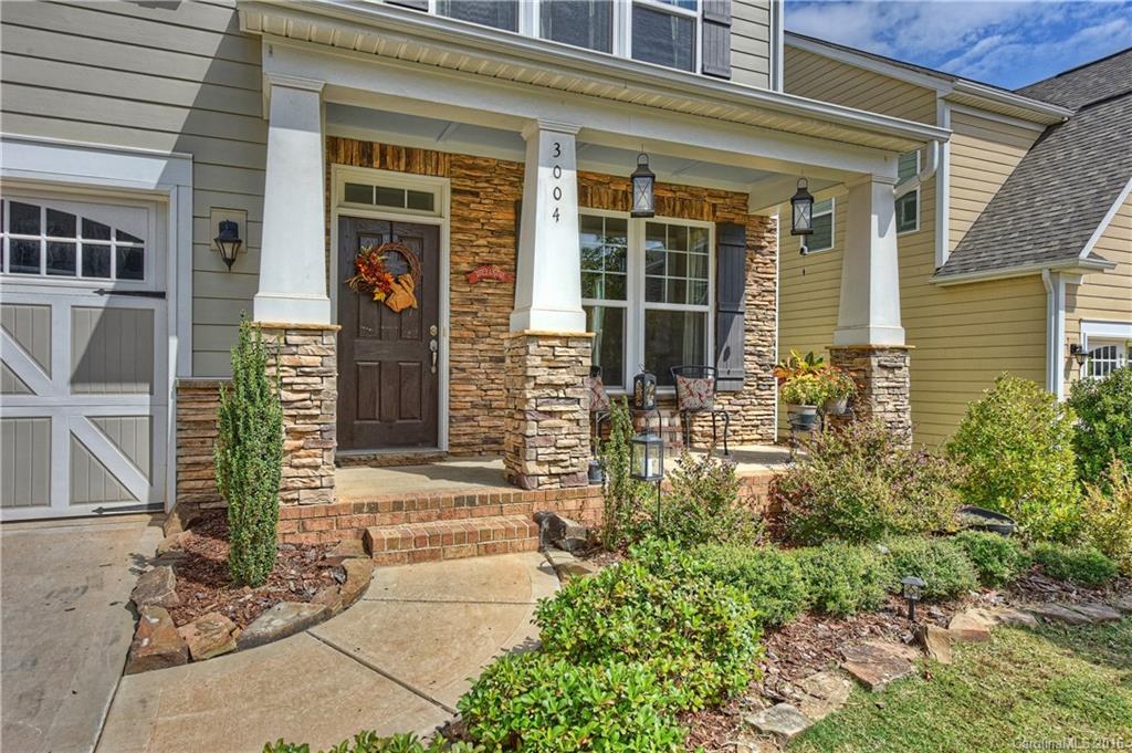 3004 Fallondale Road, Unit 906 Waxhaw, NC 28173 - Photo 2 of 24 front view of a brick house with a large window
