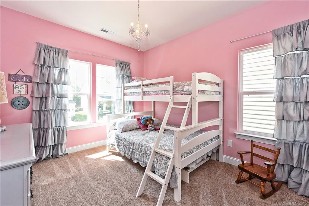 3004 Fallondale Road, Unit 906 Waxhaw, NC 28173 - Photo 19 of 24 a bedroom with furniture and a window