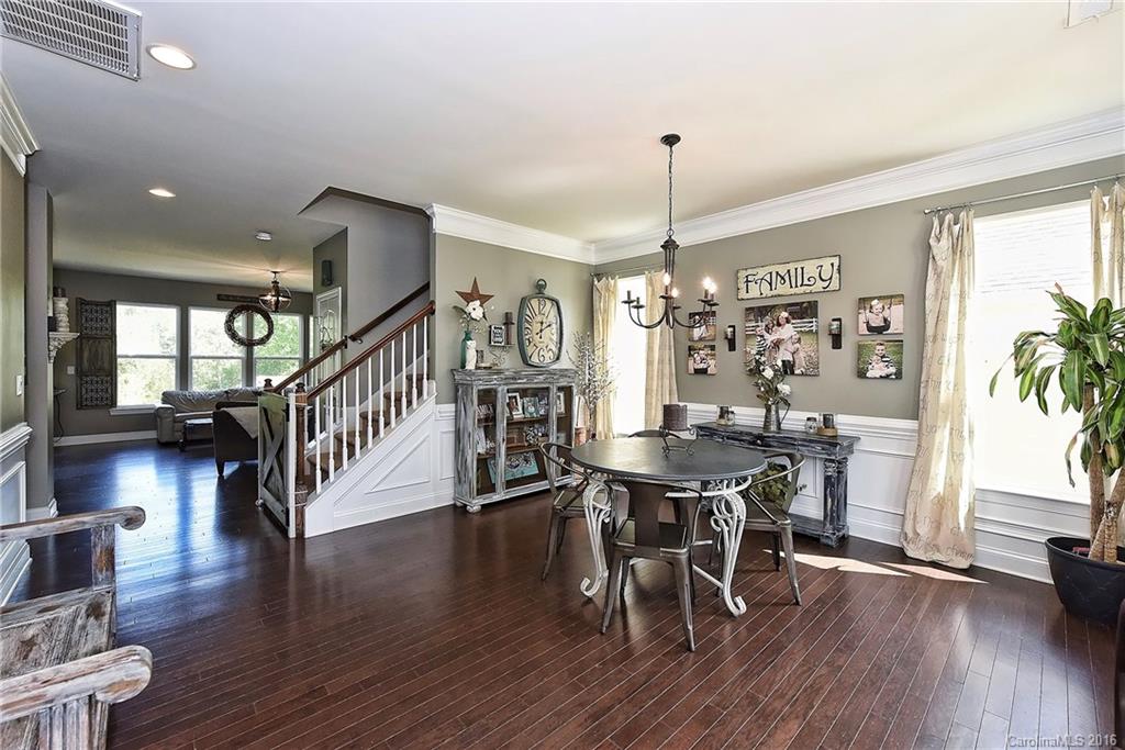3004 Fallondale Road, Unit 906 Waxhaw, NC 28173 - Photo 3 of 24 a view of a dining room with furniture window and wooden floor