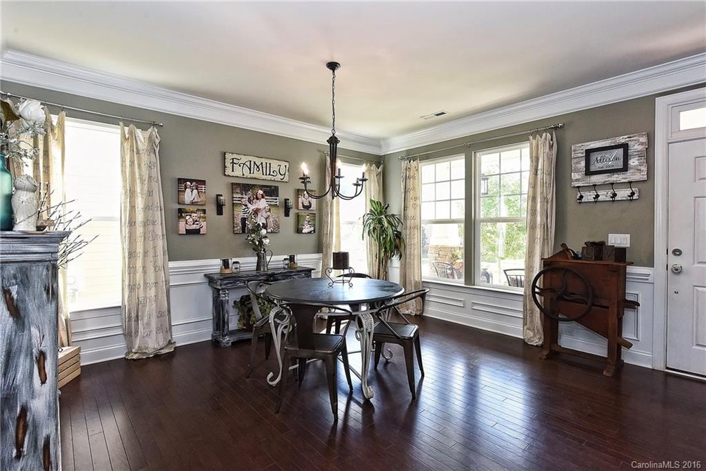 3004 Fallondale Road, Unit 906 Waxhaw, NC 28173 - Photo 4 of 24 a view of a dining room with furniture window and wooden floor