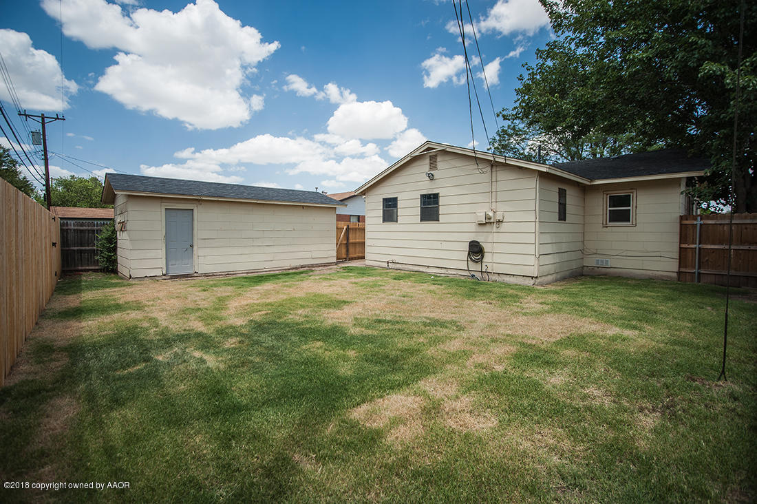 4610 South Lamar Street Amarillo, TX 79110 - Photo 9 of 10 a view of a house with a yard