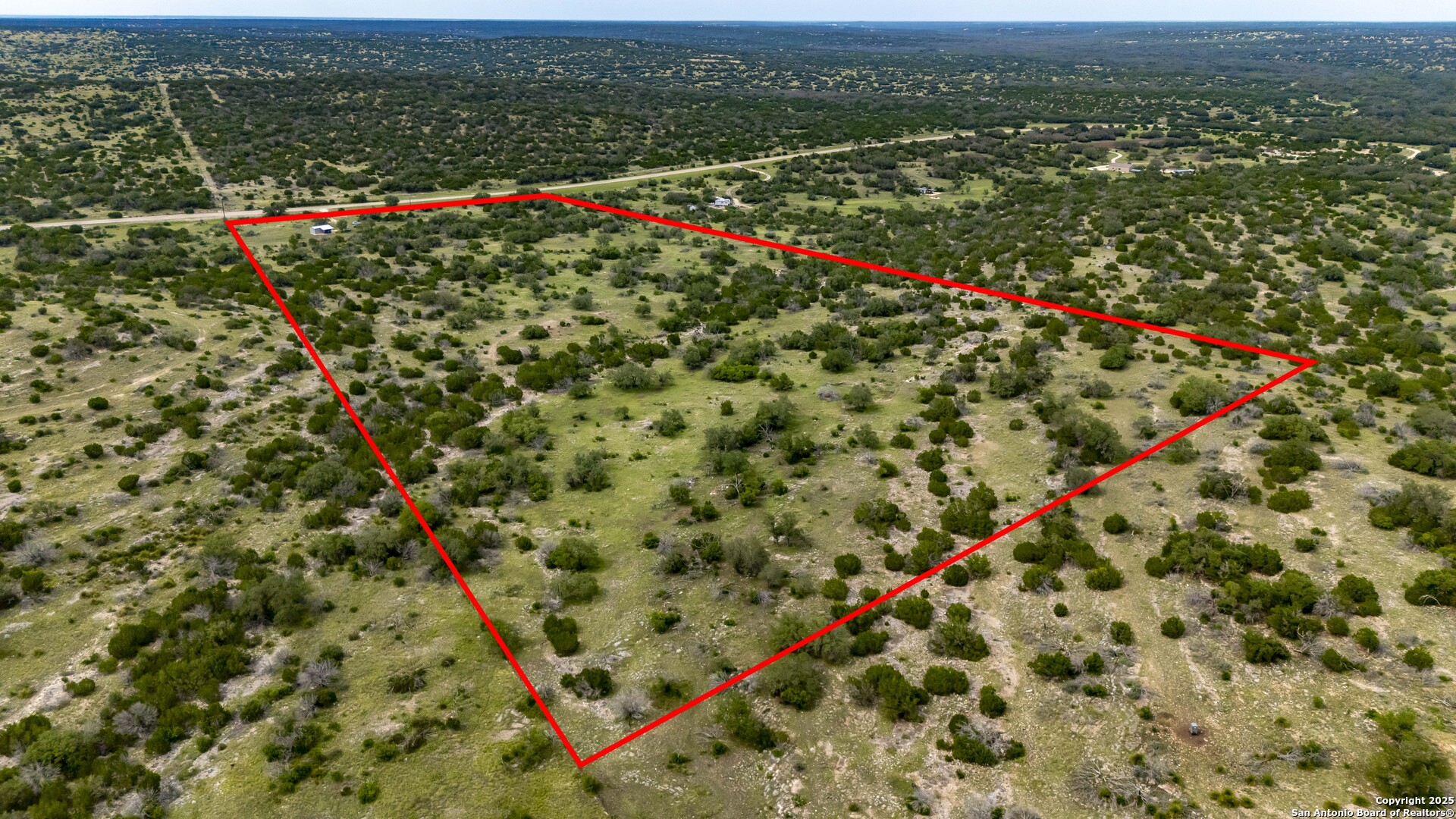 Lot 1 Hwy 377 Rocksprings, TX 78880 - Photo 29 of 35 an aerial view of a houses with a green yard
