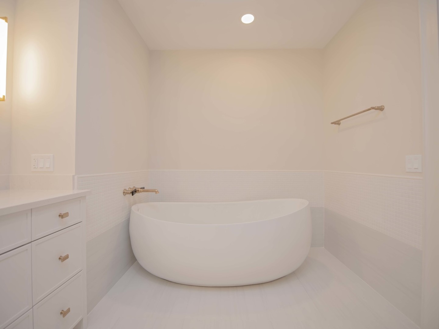 132 East Delaware Place, Unit 620507 Chicago, IL 60611 - Photo 13 of 22 a white bath tub sitting in a bathroom