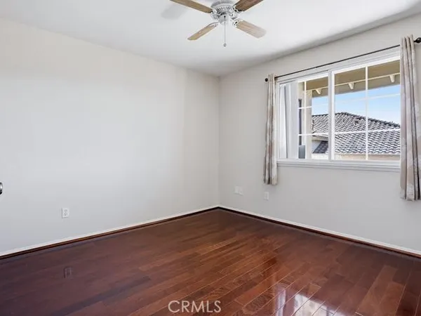 wooden floor with white walls