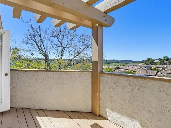 a view of a yard with wooden fence