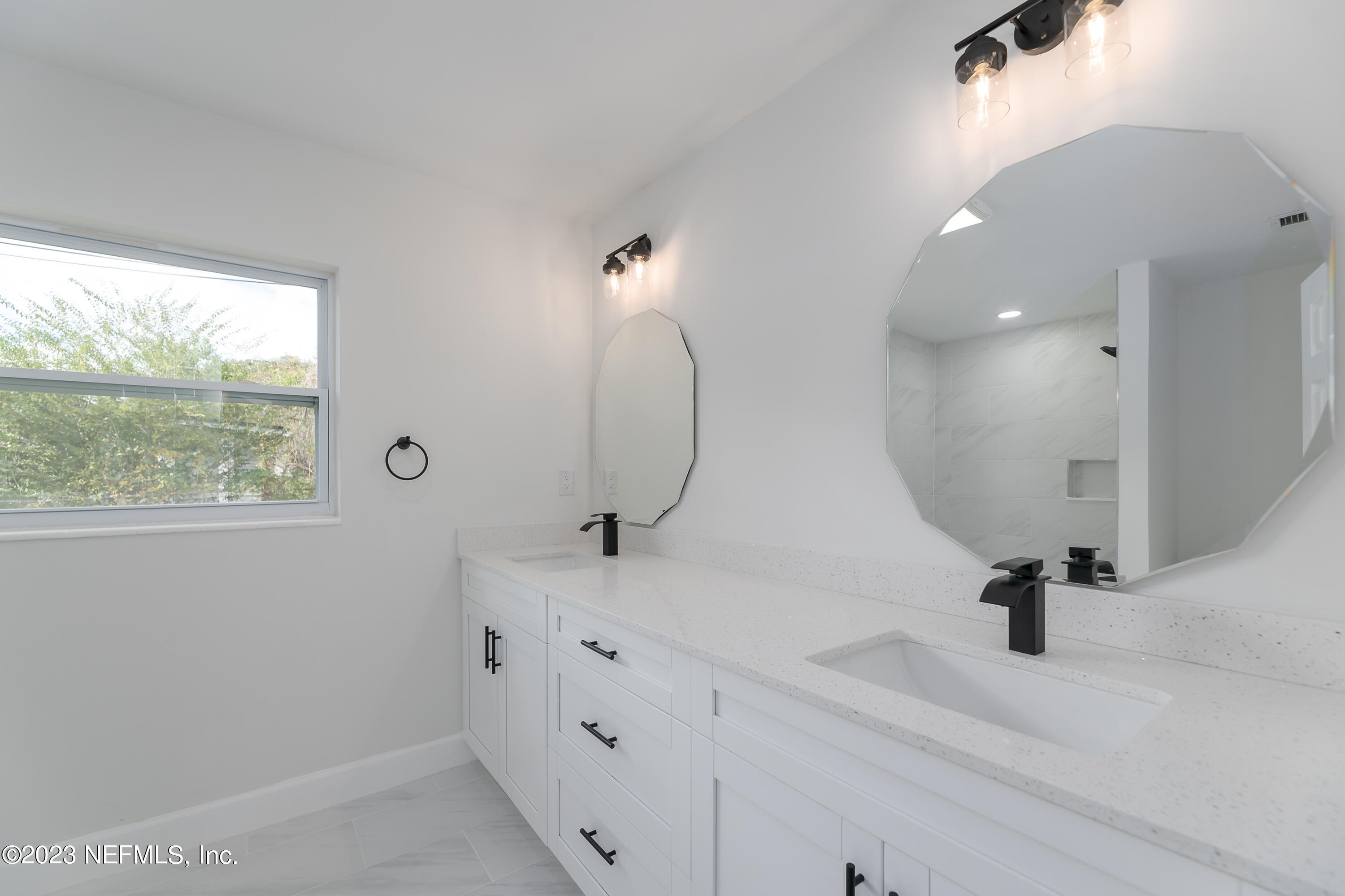 7425 Centauri Road Jacksonville, FL 32210 - Photo 18 of 23 a bathroom with a sink and a mirror