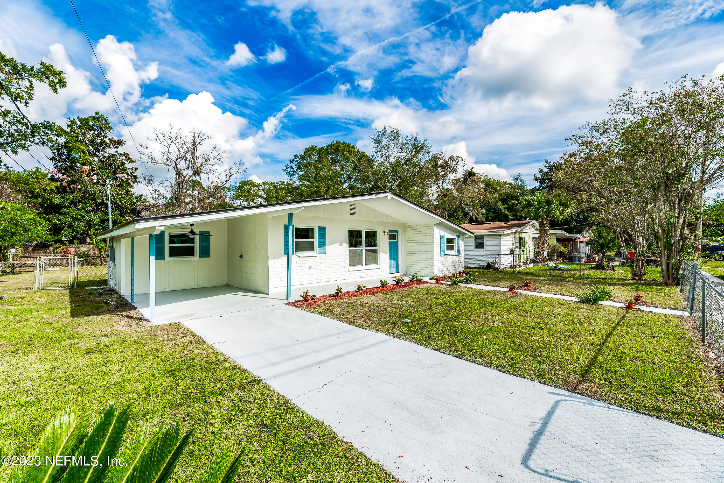 7425 Centauri Road Jacksonville, FL 32210 - Photo 2 of 23 a front view of a house with a yard