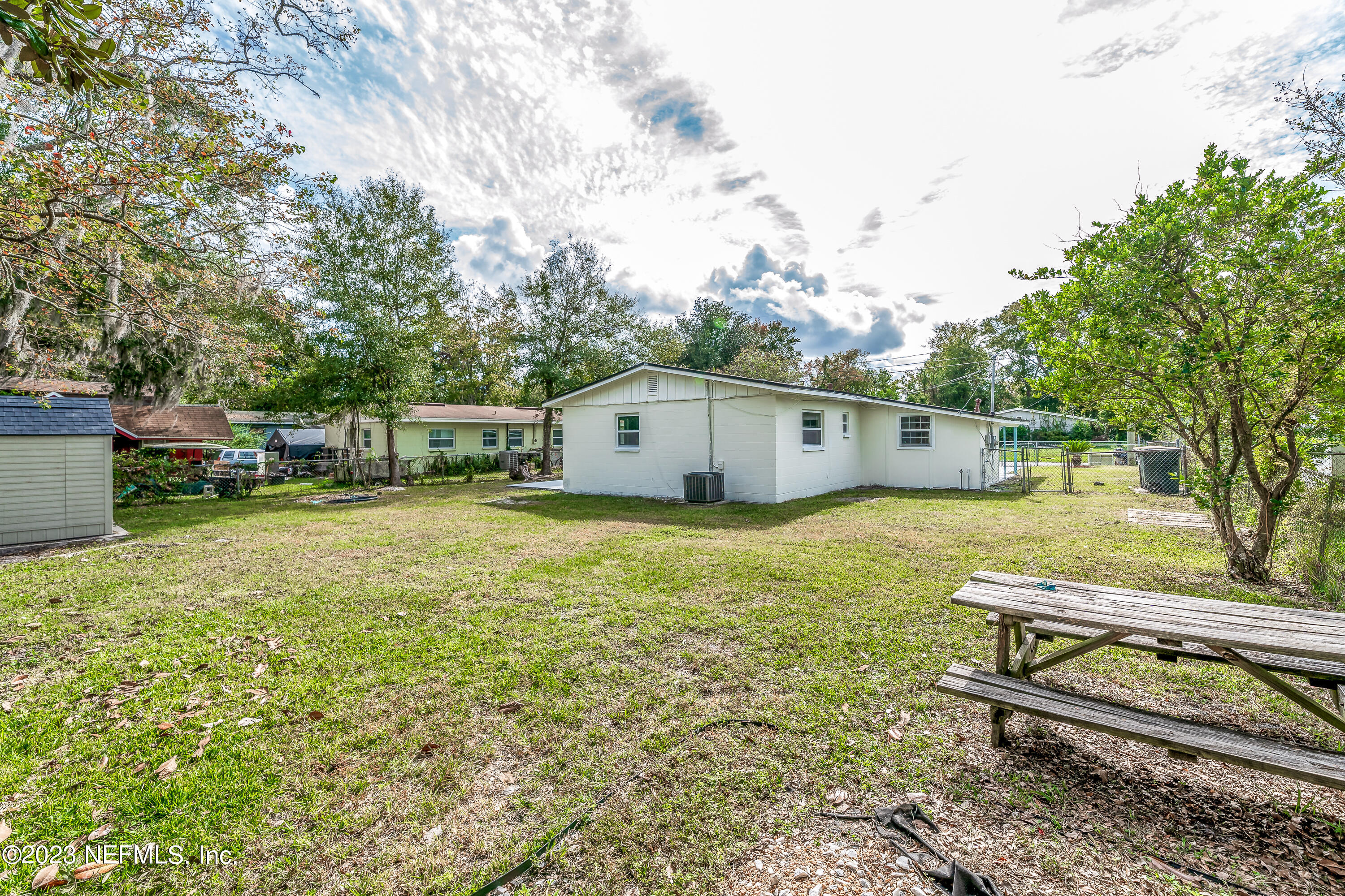 7425 Centauri Road Jacksonville, FL 32210 - Photo 23 of 23 a view of a bench in the backyard