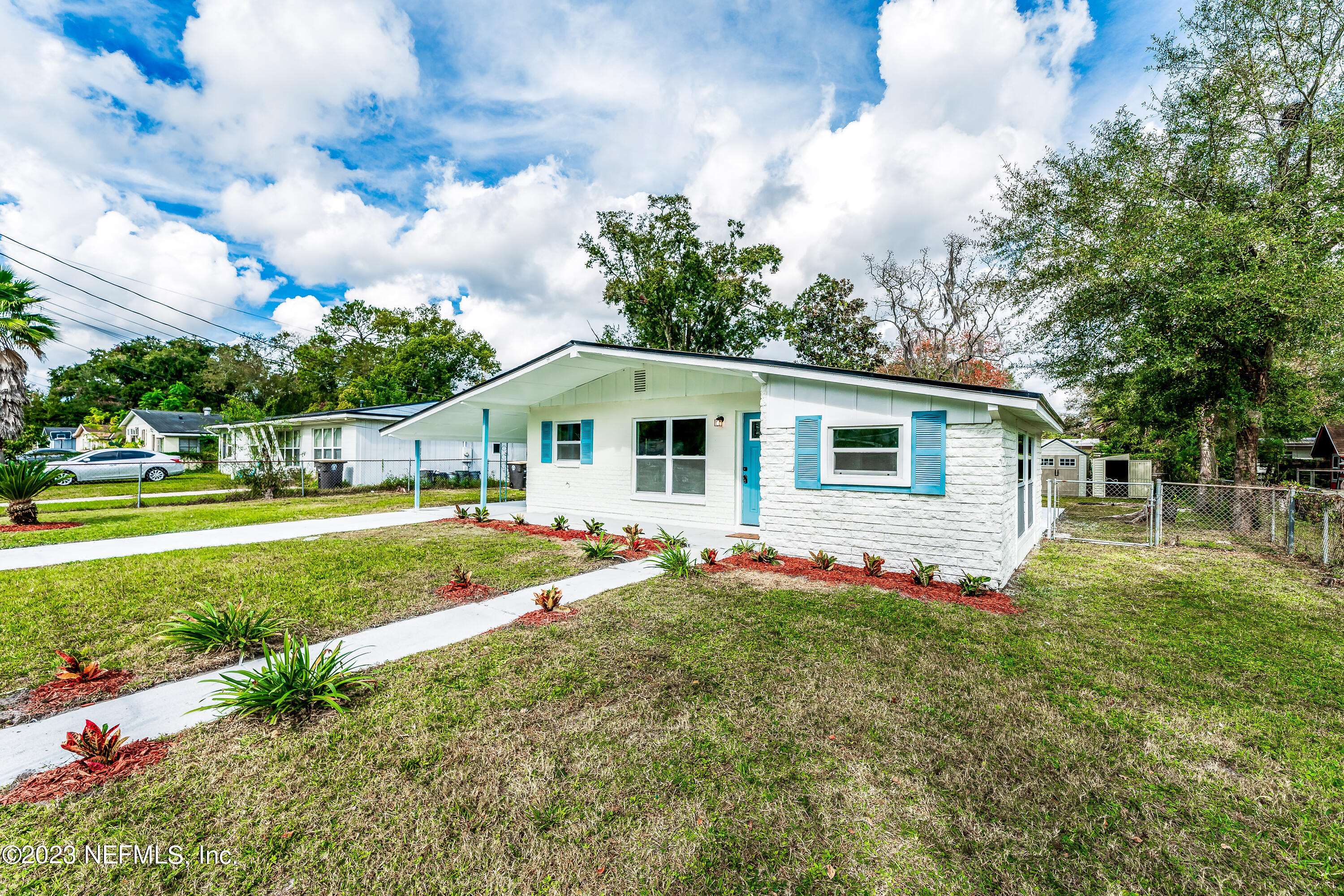 7425 Centauri Road Jacksonville, FL 32210 - Photo 3 of 23 a front view of house with yard and trees