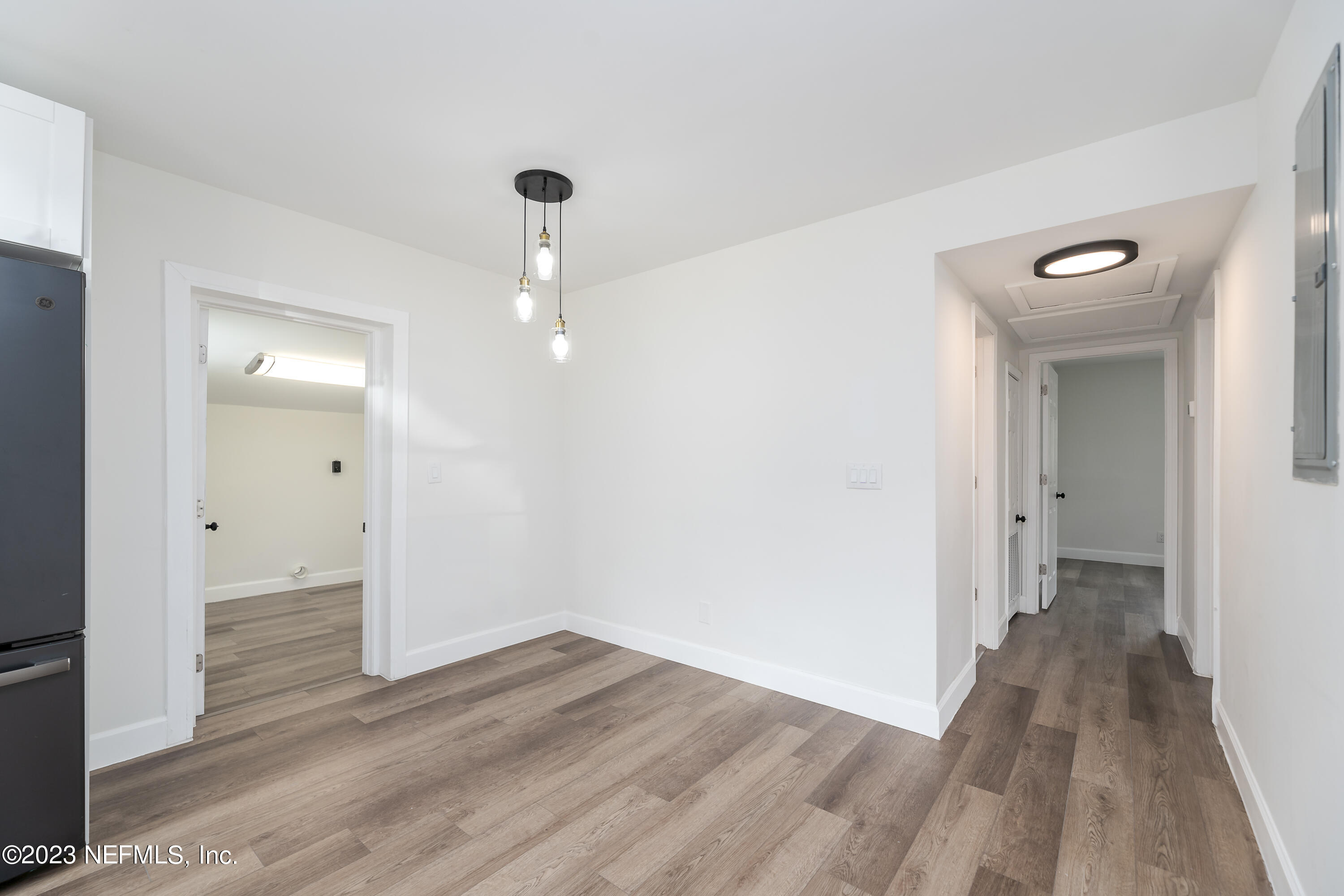 7425 Centauri Road Jacksonville, FL 32210 - Photo 7 of 23 a view of a hallway with wooden floor