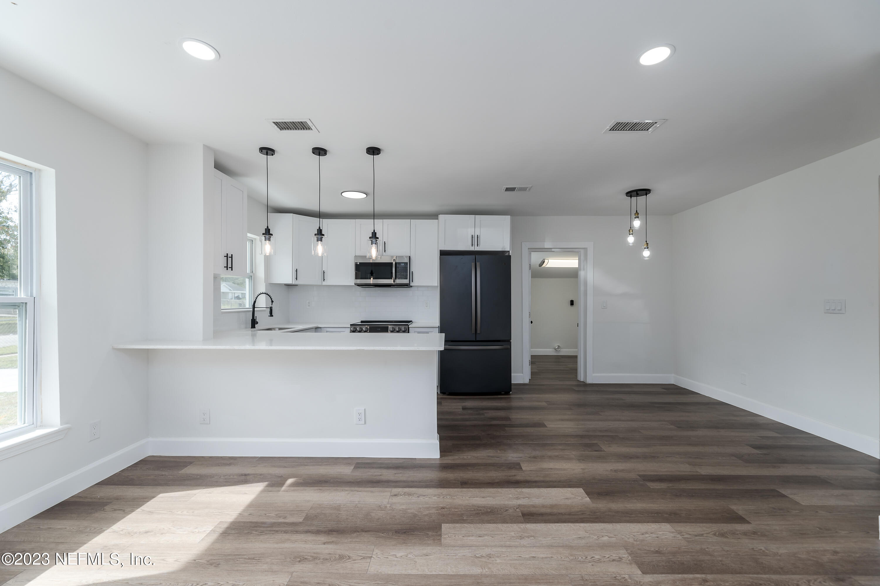 7425 Centauri Road Jacksonville, FL 32210 - Photo 8 of 23 a view of kitchen with refrigerator and window