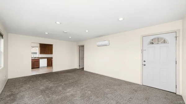 a view of a livingroom with kitchen