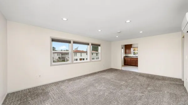 a view of an empty room with a window