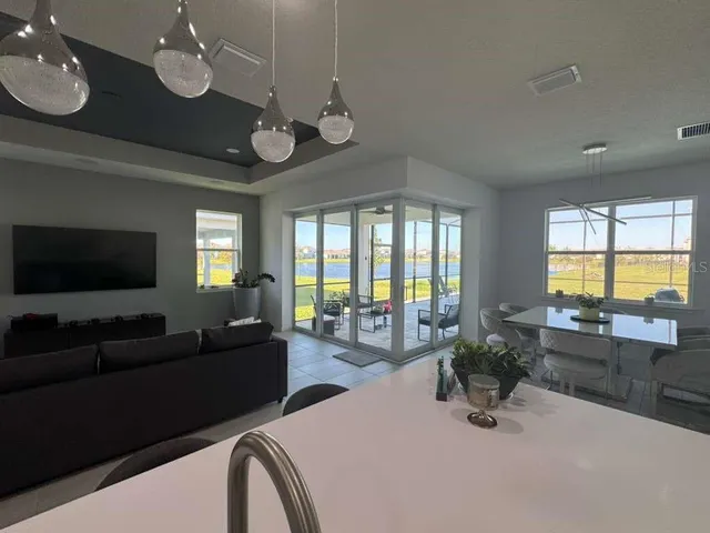a view of a livingroom with furniture window and wooden floor