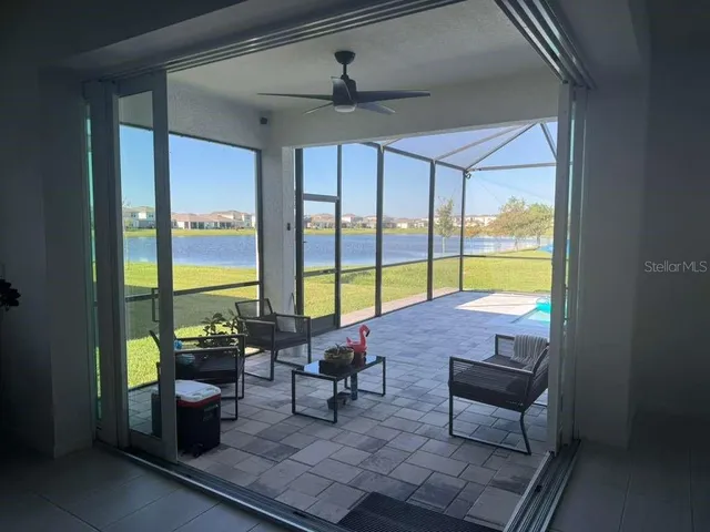 a reading room with furniture and a window