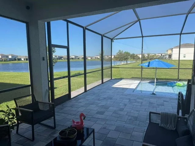 a view of a chairs and table in the patio