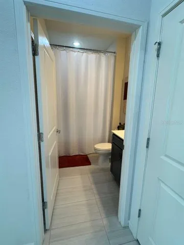 a bathroom with a shower and a toilet