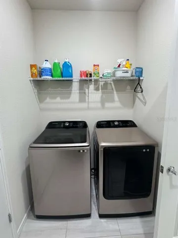 a utility room with dryer and washer