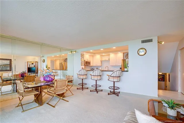 a view of a kitchen with furniture and window