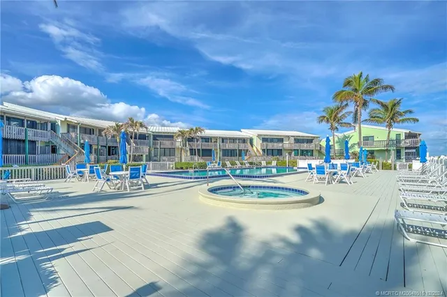 a view of a swimming pool and a chairs