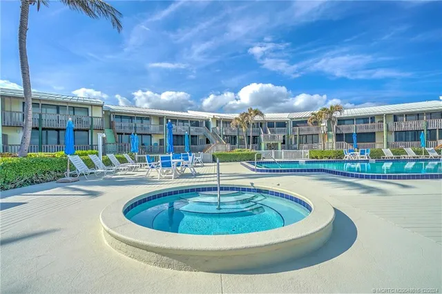 a view of a balcony with wooden floor and outdoor space