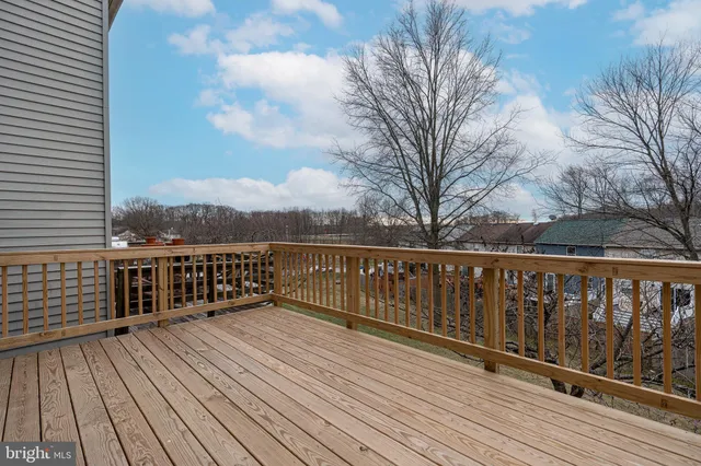 a bed room with a bed and a ceiling fan