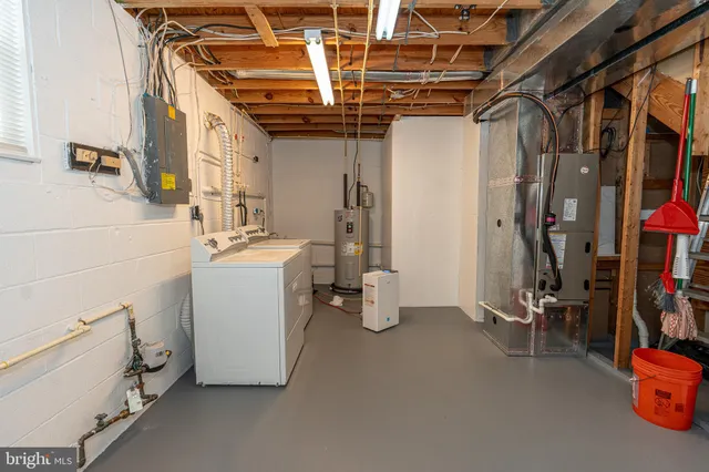 a white toilet sitting next to a bathroom sink