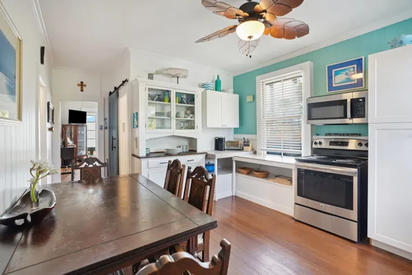 a kitchen with a stove a sink and a refrigerator