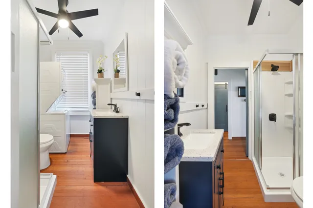 a view of a hallway with wooden floor windows and a living room