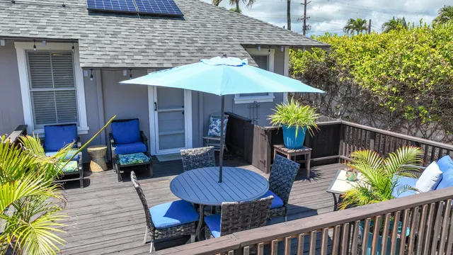 a view of a chairs and table in the patio