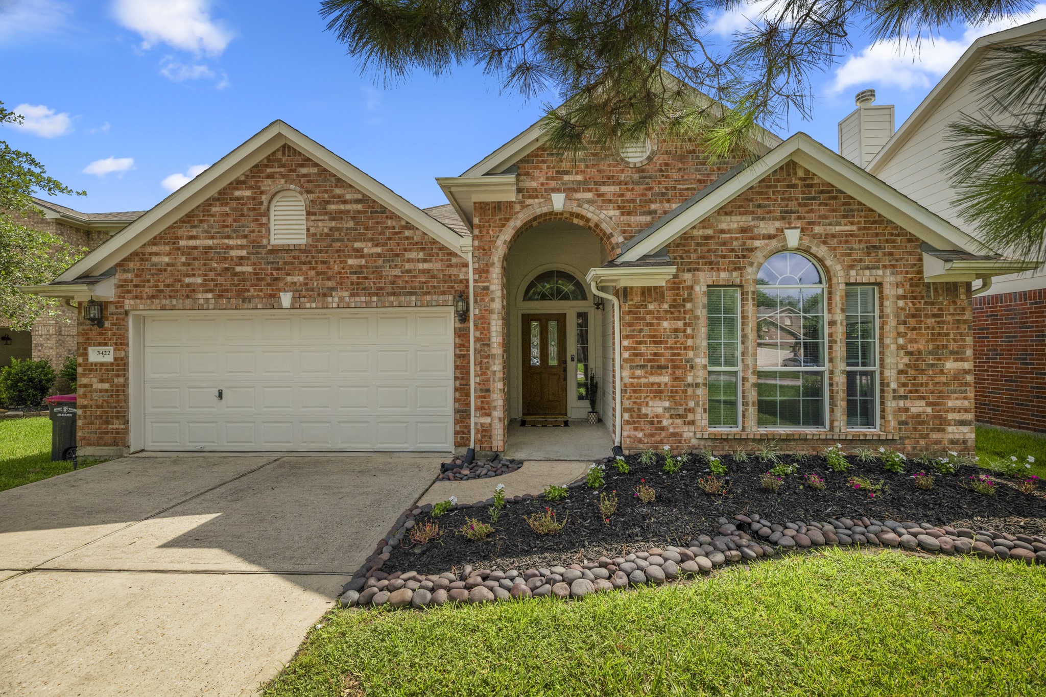 3422 Falcon Trail Court Spring, TX 77373 - Photo 1 of 35 a front view of a house with garden