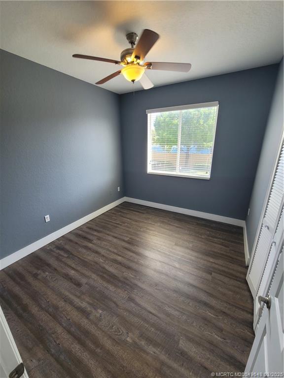 59 Southeast Palermo, Unit 204 Stuart, FL 34994 - Photo 13 of 23 an empty room with wooden floor and windows