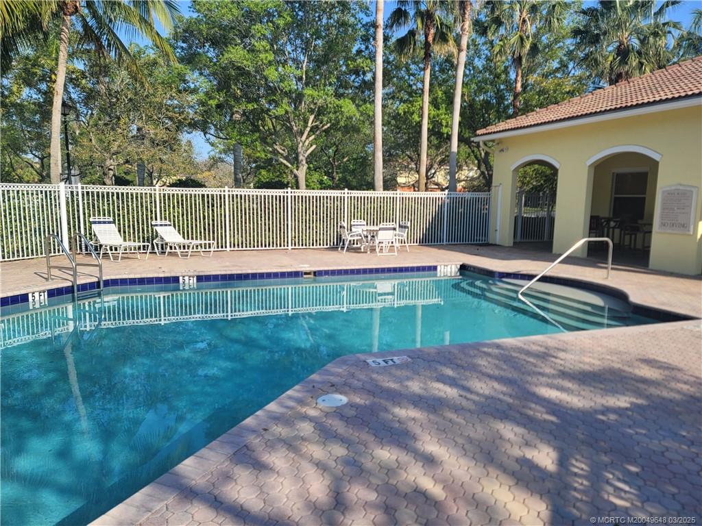 59 Southeast Palermo, Unit 204 Stuart, FL 34994 - Photo 23 of 23 a view of a backyard with sitting area
