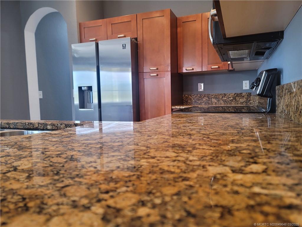 59 Southeast Palermo, Unit 204 Stuart, FL 34994 - Photo 3 of 23 a view of a kitchen with a sink