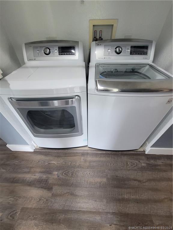 59 Southeast Palermo, Unit 204 Stuart, FL 34994 - Photo 7 of 23 a utility room with washer and dryer